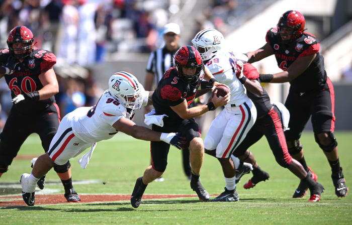 Sep 3, 2022; San Diego, California, USA; San Diego State Aztecs quarterback Braxton Burmeister (5) is tackled by Arizona Wildcats defensive lineman Tiaoalii Savea (98) during the second half at Snapdragon Stadium. Mandatory Credit: Orlando Ramirez-USA TODAY Sports